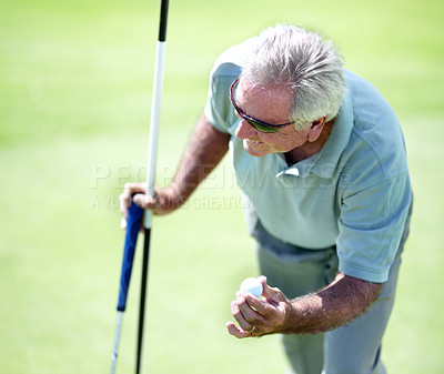 Buy stock photo Senior man, smile or golfer with a golf ball in workout or exercise with birdie success on a course. Putting, golfing celebration or happy mature player training in sports game smiling in retirement 