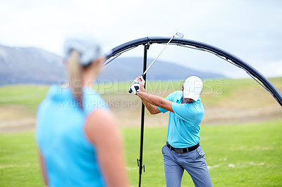 Buy stock photo Ring, drive or beginner golfer in golf course lesson for fitness, workout or exercise to learn to swing. Coaching, golfing or male athlete training with instructor for driving with a club stroke 