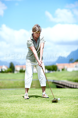 Buy stock photo Senior, woman or golfer playing golf for fitness, workout or stroke exercise on a course in retirement. Mature, golfing or serious lady player training in sports game driving with her club or driver