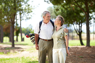 Buy stock photo Happy, golf or senior couple on course in fitness workout, exercise or round together on grass field. Love, healthy elderly man hugging, relaxing or smiling in golfing sports game with mature woman