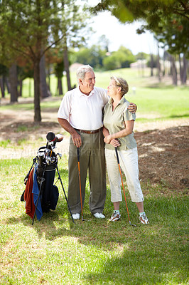 Buy stock photo Happy old couple, love or golfers on course in fitness workout, exercise or round together on grass field. Embrace, healthy elderly man hugging or smiling in golfing sports game with senior woman  