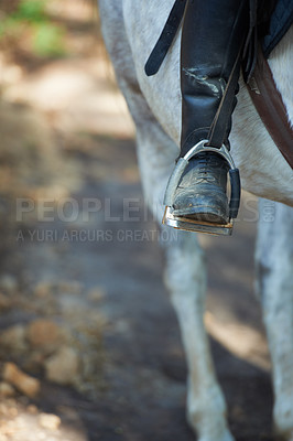 Buy stock photo Boots, horse riding or jockey in countryside outdoor with rider or person for recreation or wellness. Exercise, travel or closeup of athlete with a healthy animal for training or support on farm