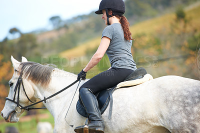 Buy stock photo Horse riding, back or woman in countryside outdoor with rider or jockey for recreation or wellness. Sports, ready or equestrian with a healthy animal to start training, exercise or workout on farrm