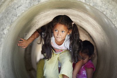 Buy stock photo Playground, children and play in tunnel, explore or having fun together. Kindergarten, tube and young girl, kids and friends playing game, adventure or learning, education and enjoying time at school