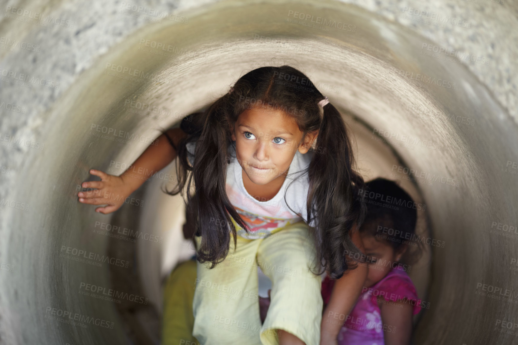 Buy stock photo Playground, children and play in tunnel, explore or having fun together. Kindergarten, tube and young girl, kids and friends playing game, adventure or learning, education and enjoying time at school