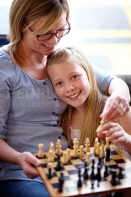 Buy stock photo Portrait, happy and a mother and child with chess for education, strategy and teaching a game. Smile, family and a girl, kid and a mom with a board for learning a hobby, playing and bonding at home
