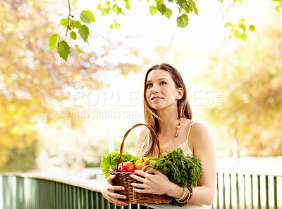 Buy stock photo Shot of an attractive young woman in the park on an autumn day