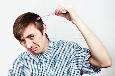 Buy stock photo Portrait of an unhappy man with bubblegum in his hair