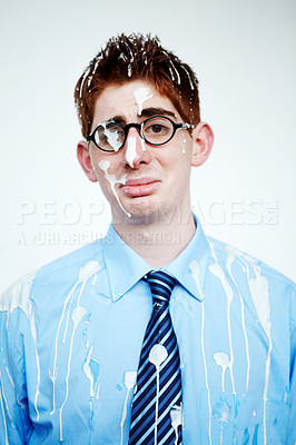 Buy stock photo Portrait, bird poo and a business man in studio on a white background for an unlucky or misfortunate mishap. Sad, depression and bad luck with an unhappy young employee in glasses after an accident