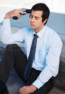 Buy stock photo Businessman, suicide and gun with stress, depression and mental health with sadness outdoor on building. Professional, person or employee and weapon with anxiety, risk or crisis with unhappy face 