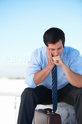 Buy stock photo Businessman, headache or stress from depression or anxiety on rooftop of building with suitcase for risk or problem. Professional, person or employee with briefcase or worry on roof for mental health