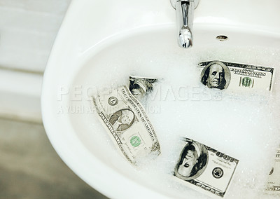 Buy stock photo Bubble water, cash and money in a basin for deal, inflation or budget in a bathroom at home. Wealth, soap and dollar bills in foam in a sink for economic fraud or bankruptcy at modern house.