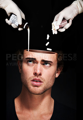 Buy stock photo Hands pour medicine in head of man, mental health and treatment in studio isolated on a black background. Pills, sick person and antidepressant drugs or medication for depression, anxiety and stress