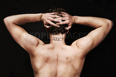 Buy stock photo Back, drug addict and body of man in studio isolated on black background. Rear view, addiction and naked person with depression, anxiety and mental health crisis, challenge and substance abuse tattoo
