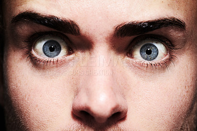 Buy stock photo Closeup, face or eyes of shocked person with fear, terror and anxiety for schizophrenia or mental health. Man, stress or crazy looking with addiction, user and psychosis for insomnia, emotion or risk