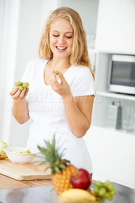 Buy stock photo Fruits, eating grapes or happy woman with healthy morning meal or lunch meal or diet in kitchen at home. Breakfast, smile or vegan girl enjoying a fruit salad or food bowl to lose weight for wellness