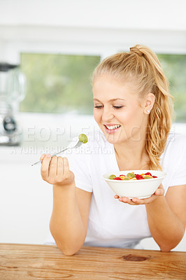 Buy stock photo Fruit salad, eating or happy woman with a snack, morning breakfast or lunch diet in home kitchen. Smile, gut health or vegan girl with fruits, grapes or food bowl meal to lose weight or wellness