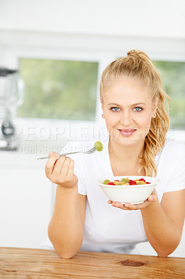 Buy stock photo Fruit salad, eating or portrait of happy woman with a snack, morning breakfast or lunch diet in home kitchen. Face, gut health or girl with fruits, grapes or food bowl meal to lose weight or wellness