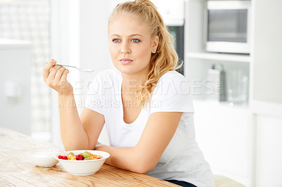 Buy stock photo Fruit, thinking and woman eating healthy food or breakfast meal or diet in the morning in her home kitchen. Nutrition, health and vegan person smile and happy for salad, balance and self care