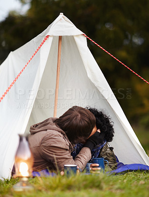 Buy stock photo Nature, camping and couple kissing in tent in outdoor woods or forest in Canada. Happy, adventure and young man and woman with affection in canopy for shelter on holiday, vacation or weekend trip.