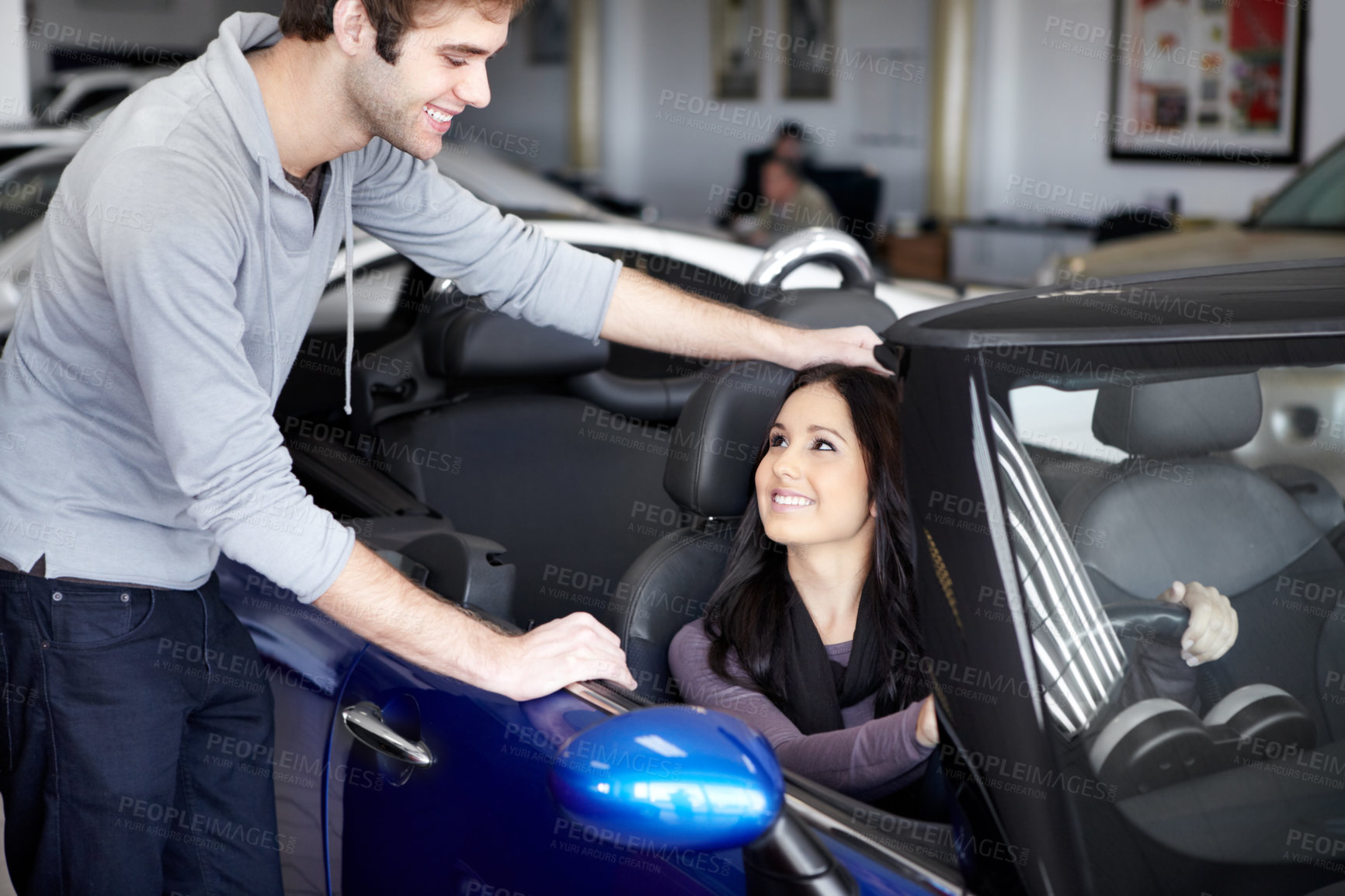 Buy stock photo Dealership, discussion and woman buying a car with salesman for a test drive for choosing transport. Smile, purchase and young female person in a new vehicle talking to employee at a shop or store.