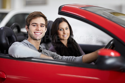Buy stock photo Happy, dealership and portrait of couple in a car after a purchase together for romance. Smile, love and young man and woman from Canada buying new vehicle for relationship in showroom for transport.