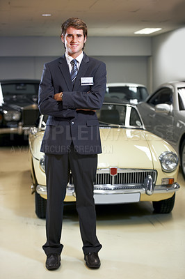 Buy stock photo Car, salesman in portrait at dealership and arms crossed with smile, transport and sales job. Worker, vehicle for driving and professional man with career, happiness and selling luxury automobile