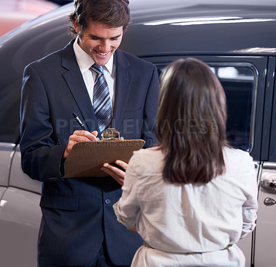 Buy stock photo Car dealership, woman and man with contract for signature, sale and document writing for payment with smile. Girl, paperwork and happy for deal with legal agreement, loan and compliance for vehicle