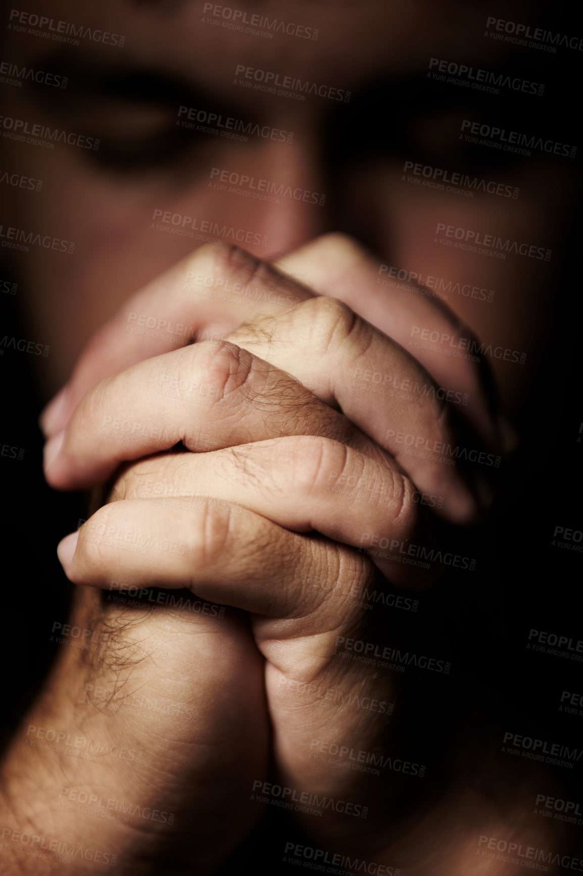 Buy stock photo Praying, hands and man for faith, hope and religion or asking for help with mental health, depression or worship in dark room. Sad Christian person with peace, spiritual guidance and God for support