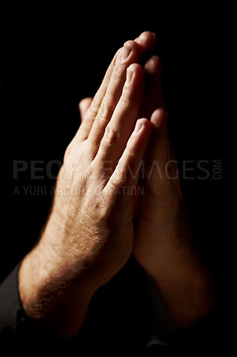 Buy stock photo Prayer, hands and black background for faith, hope and religion or asking for help with mental health or support in studio. Praying emoji, christian person and God, holy spirit or peace in dark room