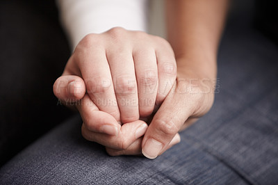 Buy stock photo Cropped shot of two people holding hands in comfort