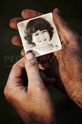 Buy stock photo Hands, holding picture of kid and portrait, nostalgia or remember memory of family or child isolated on black background in studio. Closeup, photo of boy and dirty fingers of homeless man in poverty
