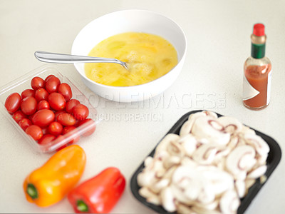 Buy stock photo Cooking preparation, ingredients and breakfast on a counter for health, nutrition and protein. Kitchen, healthy and omelette food, eggs and product on a table in the morning ready to cook for diet