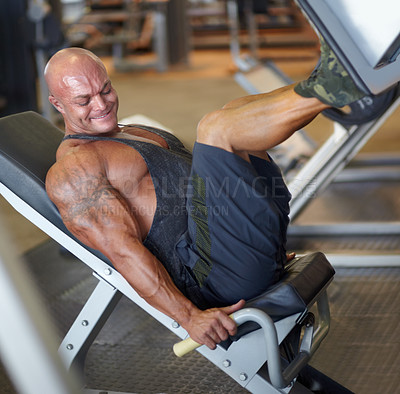 Buy stock photo Leg press, man and fitness at gym with bodybuilder, cardio and muscle power at health club. Wellness, athlete and exercise machine with heavy weight and strain from bodybuilding, sport and workout