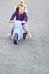 Having fun on her tricycle