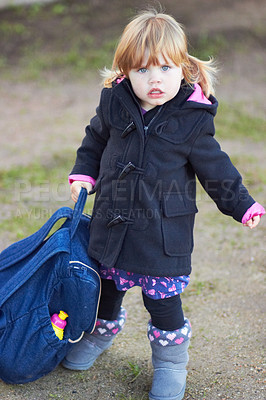 Buy stock photo Winter, fashion and portrait of baby in outdoor for cute, trendy and growth. Child development, sweet and style with young girl and backpack walking in park for urban, season and adorable