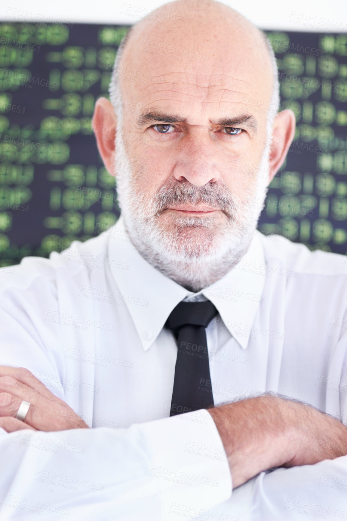 Buy stock photo Portrait of a serious stock broker standing with his arms folded