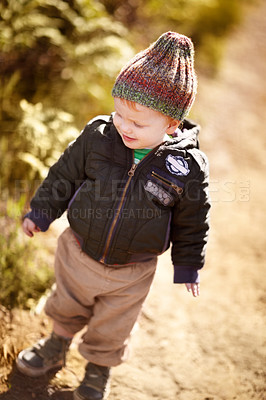 Buy stock photo Happy, walking and child in nature on adventure, hiking and freedom on dirt path to explore. Countryside, childhood and young, curious and excited kid outdoors on holiday, vacation and travel