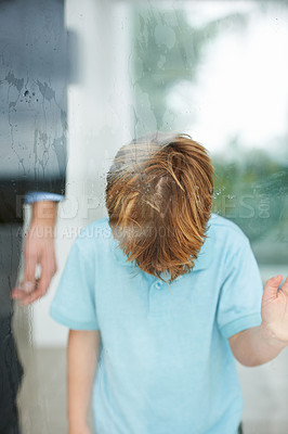 Buy stock photo Sad, child and home by window to play outside, anxiety and lonely for fear, conflict and trauma in family.  Young, boy and depression for stay indoor, glass or mental health for balance childhood