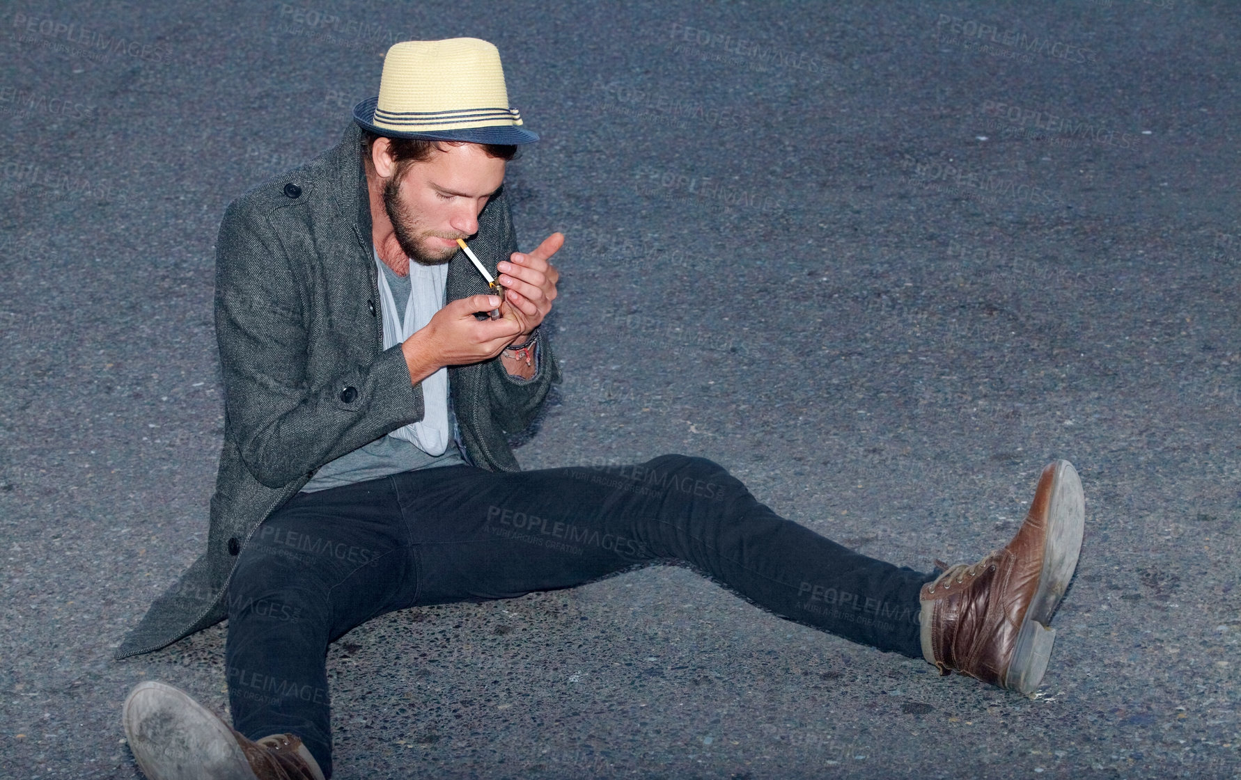 Buy stock photo Hipster, man and sitting in road with cigarette for smoking, fashion or experience outdoor on ground. Person, smoke and street for adventure, travel or downtown with tobacco, light and confidence