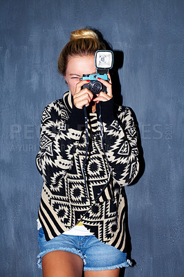 Buy stock photo Shot of an attractive hipster taking a picture with a retro camera