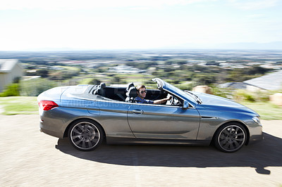 Buy stock photo Blur, smile or man drive sports car on road, travel or journey outdoor on trip. Happy person with sunglasses in motor vehicle, speed or fast on street for freedom in luxury convertible transportation