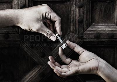 Buy stock photo Cropped image of two hands putting together a nut and bolt