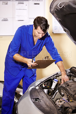Buy stock photo Checklist, man and mechanic check engine of car, repair or maintenance. Clipboard, technician and serious person on motor vehicle, fixing transport or reading inspection list at auto service workshop