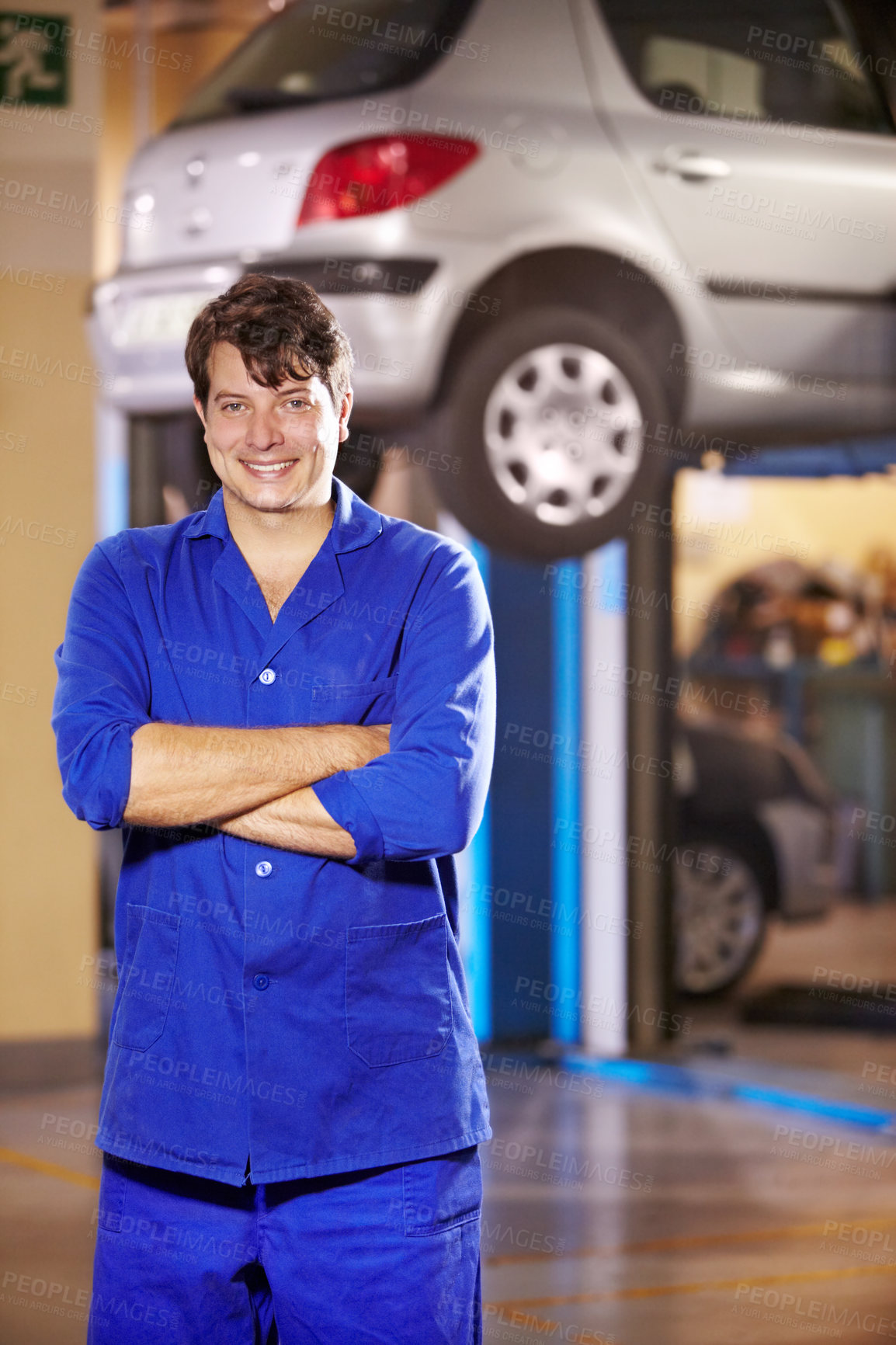 Buy stock photo Portrait, happy man and mechanic with arms crossed at garage, service workshop or business. Confident, smile or professional technician, motor car repair expert or auto maintenance engineer in Canada