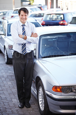 Buy stock photo Portrait, lease and a man arms crossed at a dealership for car sale in a commercial parking lot. Business, rental and automobile trade with a happy young salesman outdoor for transport service