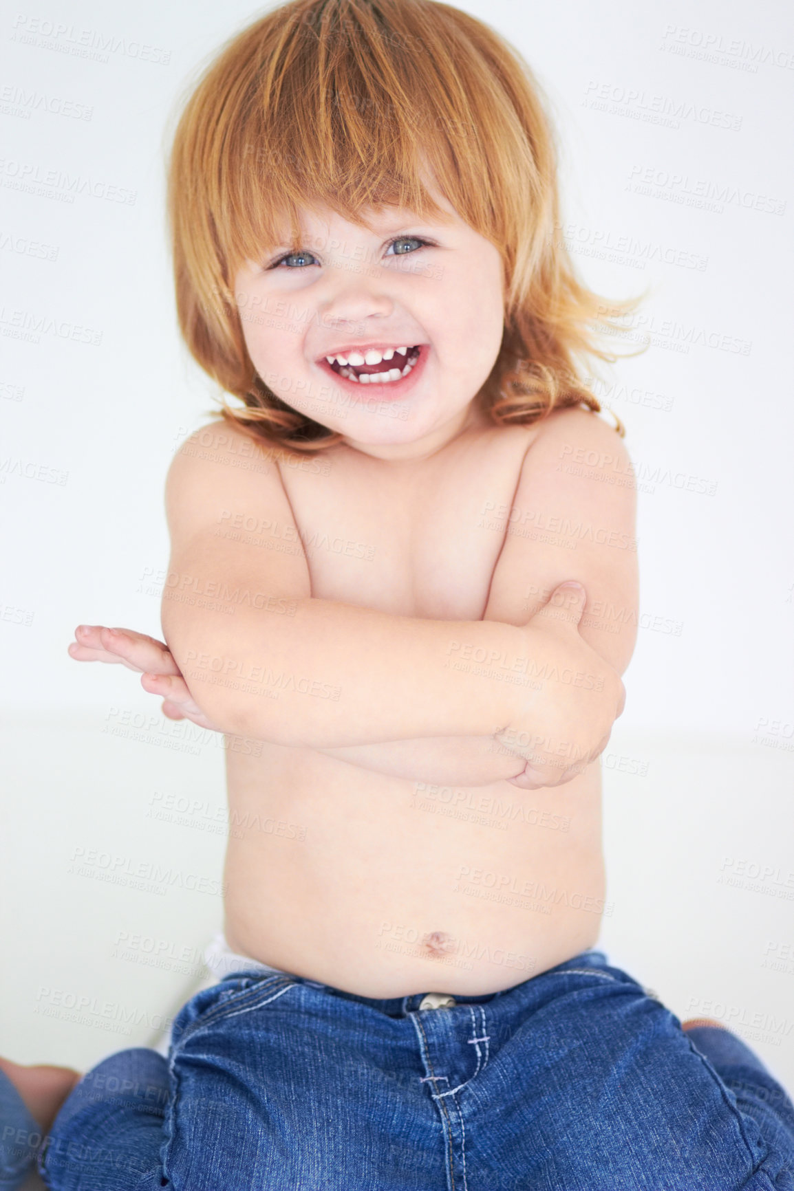 Buy stock photo Young kid, laughing and arms crossed portrait of a toddler in studio with a smile. Ginger infant, laugh and happy in a house with joy and positivity from childhood isolated with white background