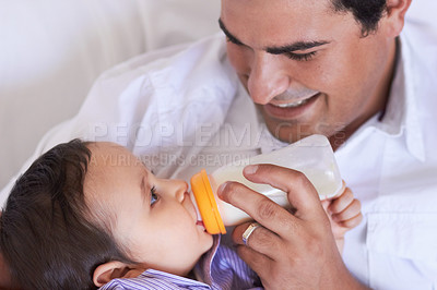 Buy stock photo Baby, feeding and dad with child at home with a bottle of milk with happiness with kids. Family, young child and drink for growth and development with a father feeling proud and happy in a house