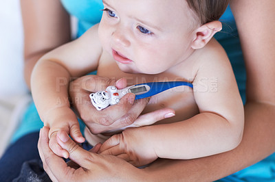 Buy stock photo Baby, armpit and thermometer to measure of fever for sick with parent while holding hand in trust. Mother, infant and childcare for health, treatment or test of virus, illness or infection at home
