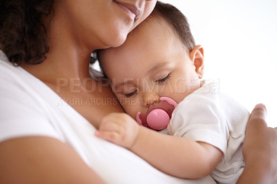 Buy stock photo Baby, face and girl sleeping with mom holding newborn or mother with child, pacifier and morning rest together. Calm, infant and peace in sleep with mommy, love or cuddle in bedroom with kid